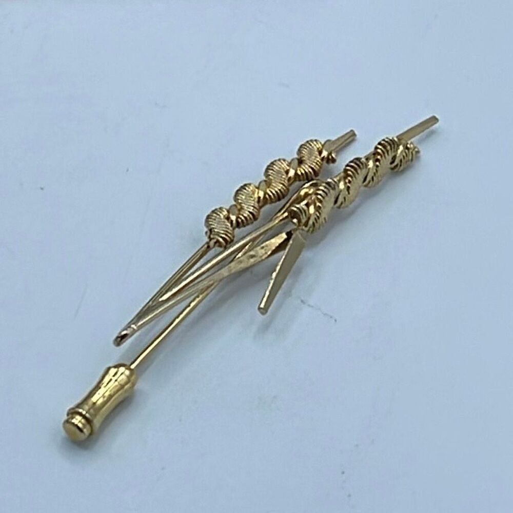 Vintage Double cat tail gold tone lapel pin.